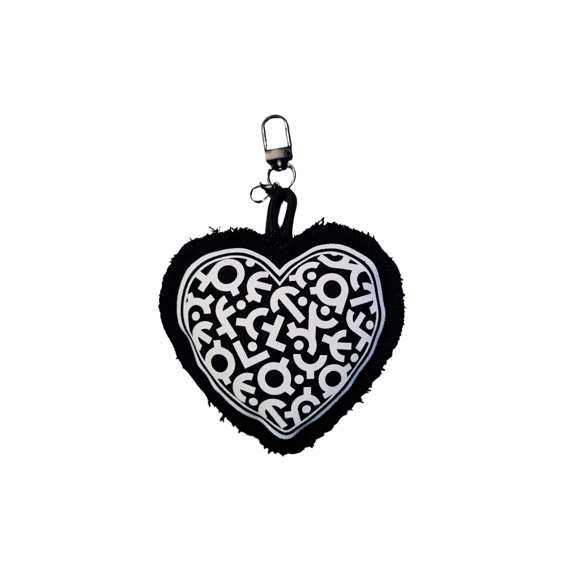 Heart-shaped keychain with black and white design on a white background