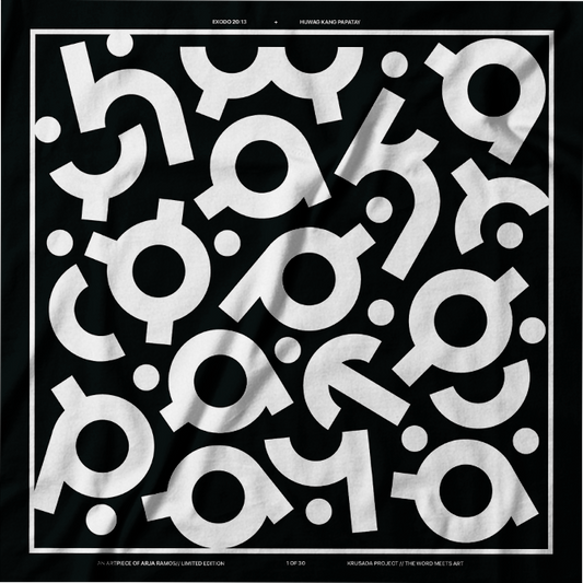 A square black fabric item, likely a bandana or scarf, featuring a bold white graphic print of stylized calligraphy characters arranged in an abstract pattern. The fabric has a visible texture and is photographed flat against a black background.